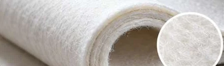 Roll of white needled press felt with a close-up of its surface